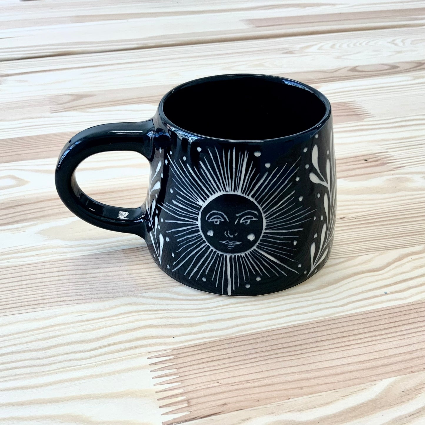 Black Mug with Sun